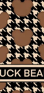 Brown bear silhouette on houndstooth pattern wallpaper.