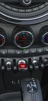 Car interior with modern dashboard controls, showcasing sleek design.