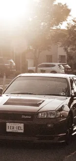 Stylish black car on a sepia-toned street with a warm, vintage atmosphere.