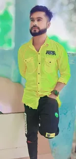 Man in neon green shirt with stylish casual look.