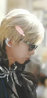 Profile view of a stylish character with sunglasses and blonde hair.