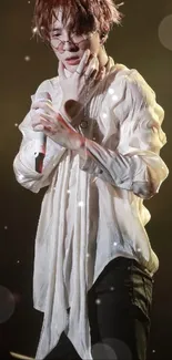 Performer in stylish concert pose under dramatic stage lights.