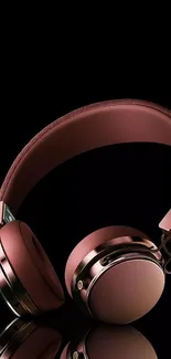 Stylish copper headphones on a black background wallpaper.