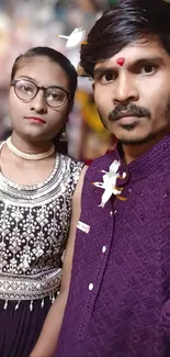 Couple in ethnic attire posing for a portrait.