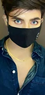 Fashionable masked person in denim shirt portrait.