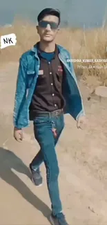 Young man in stylish denim walking outdoors.