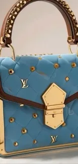 Luxurious designer handbag with blue and gold details.