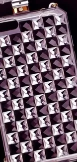 Diamond-studded phone case on a black background.