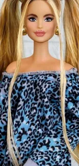 Doll with long hair in leopard print top.