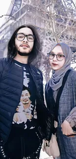 Fashionable pair in front of Eiffel Tower, Paris.