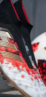 Football boots with red and black pixel design next to soccer ball.