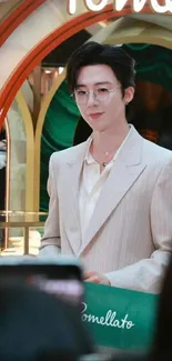 Man in cream suit at an elegant event.