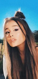 Stylish young woman with long hair in an outdoor setting.