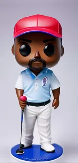 Golfer figurine with red cap and blue shirt on a blue base.