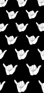 Black and white shaka hand pattern wallpaper.