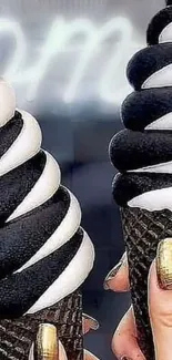 Black and white ice cream cones with gold glitter nails.