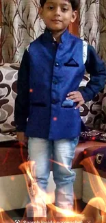 Young boy in a blue jacket, striking a stylish pose.