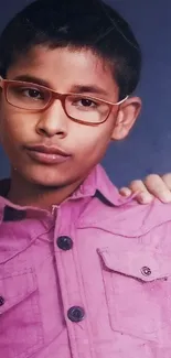 Mobile wallpaper of a young boy wearing a pink shirt and glasses.