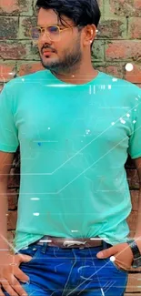 Man in turquoise shirt against a brick wall.