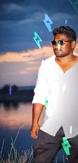 Man in white shirt and sunglasses by a lake at sunset with blue lighting effects.