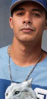 Portrait of a stylish man wearing a blue shirt and cap, exuding confidence.