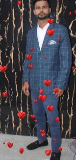 Man in blue suit with black marbled background.