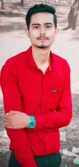 Outdoor portrait of a stylish man in a red shirt.