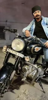 Man sitting on classic motorcycle at night.