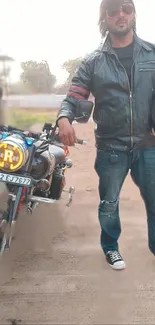 Man in leather jacket standing by motorcycle.