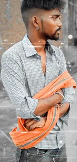 Stylish man in gray shirt with orange scarf.