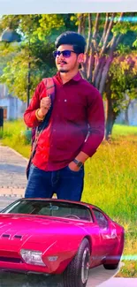 Young man with red car in vibrant outdoor setting.