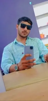 Stylish man taking a selfie with sunglasses.