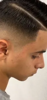 Close-up of a stylish men's haircut with a sleek fade.