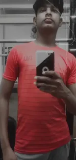 Vibrant mirror selfie in a red t-shirt for a trendy mobile wallpaper.