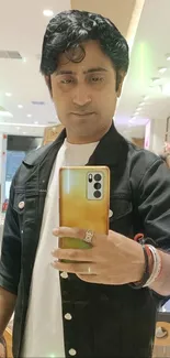 Stylish mirror selfie in fashionable store setting.