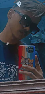 Mirror selfie with stylish phone case in dark blue tones.