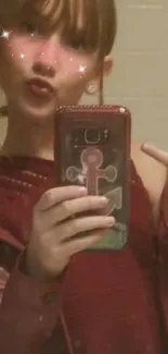 A trendy mirror selfie featuring a person in a red outfit with a sparkling filter effect.