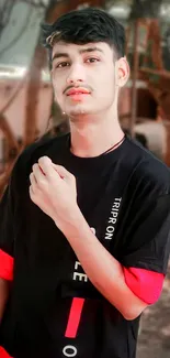 Fashionable young man in black and red shirt with sepia background.