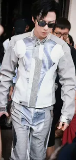 Futuristic grey fashion attire in a crowd setting.