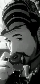 Monochrome wallpaper of a stylish man enjoying a donut.