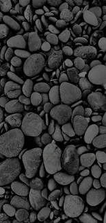 Monochrome pebble wallpaper with dark smooth stones for mobile.