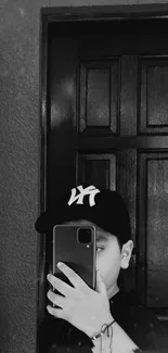 Monochrome wallpaper featuring a person with a cap, capturing a modern style.