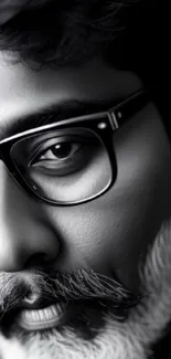 Monochrome portrait with glasses and styled mustache on sleek wallpaper design.