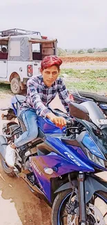 Young person on a blue motorcycle, in a rural outdoor setting, ready for adventure.