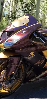 Stylish maroon and gold motorcycle amidst aspen trees.