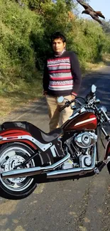 Motorcycle parked on a scenic road with foliage background.