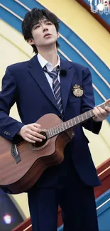 Musician in blue suit passionately playing a guitar.