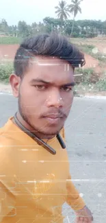 Person in yellow shirt walking by a scenic road.