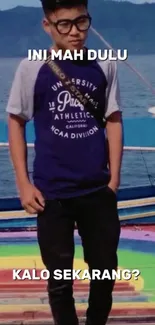 Teen in casual wear standing on colorful boat with sea background.