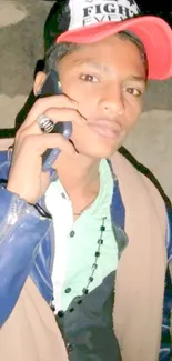 Young man in cap making a phone call.